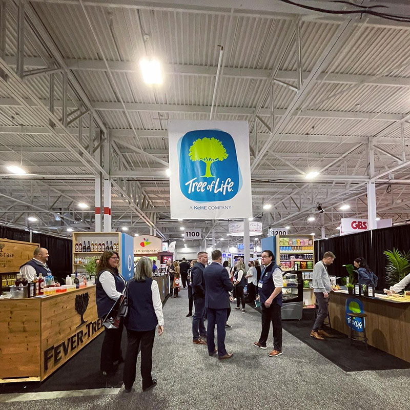 A Tree of Life banner hanging in an event venue