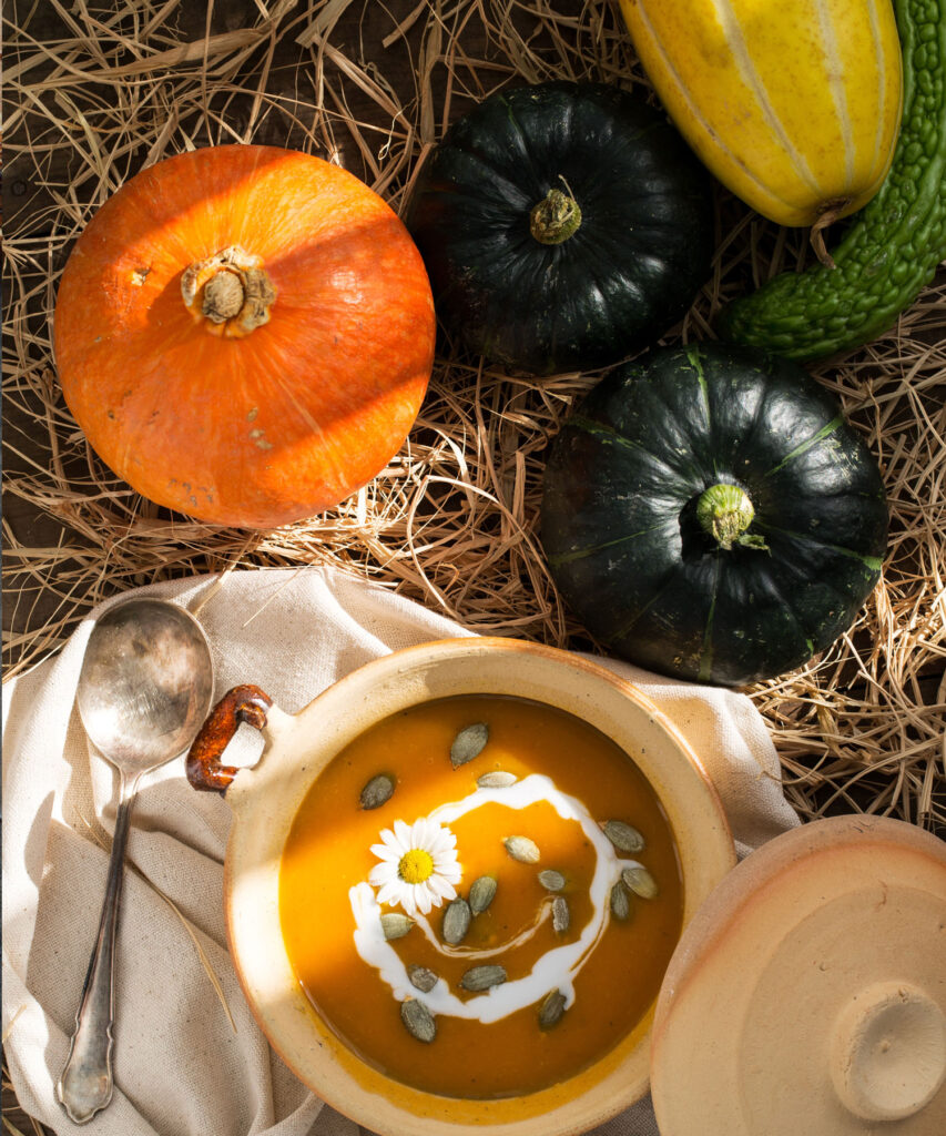 Squash with a bowl of squash soup