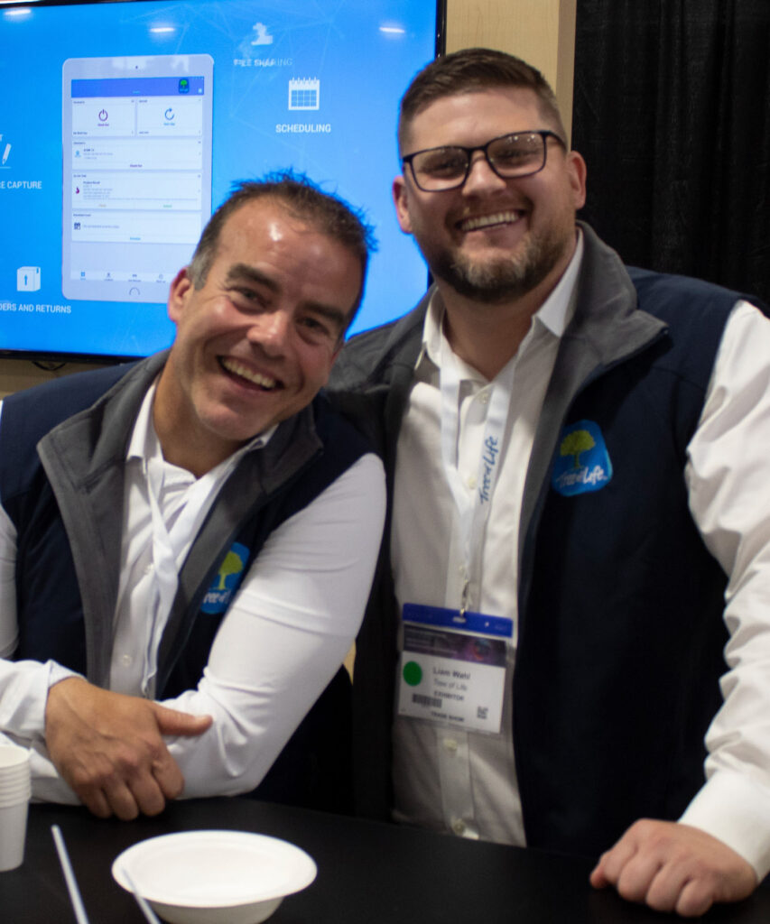 Two smiling Tree of Life employees